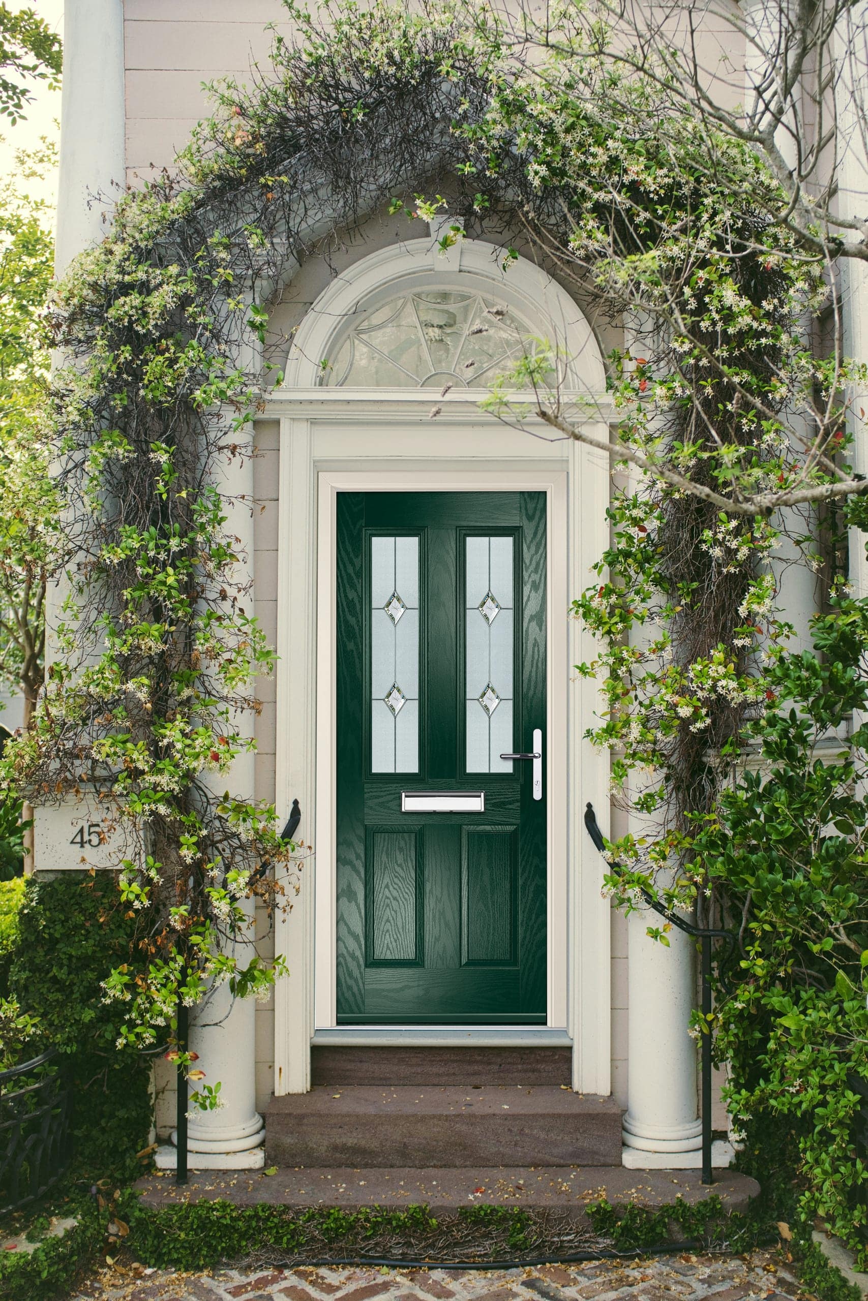 Green composite front door with glazed panels