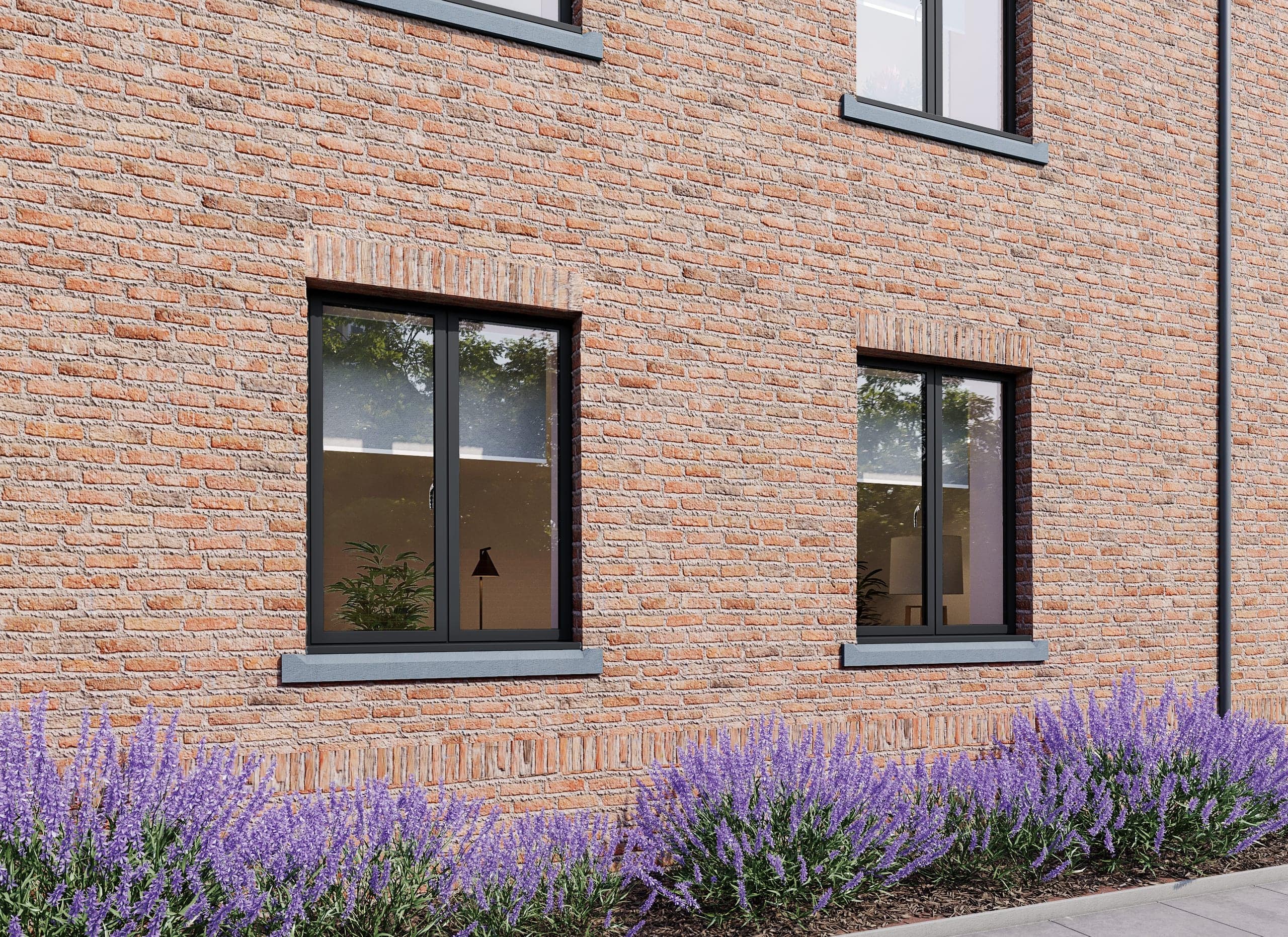 Slim anthracite-grey aluminium windows on a brick house