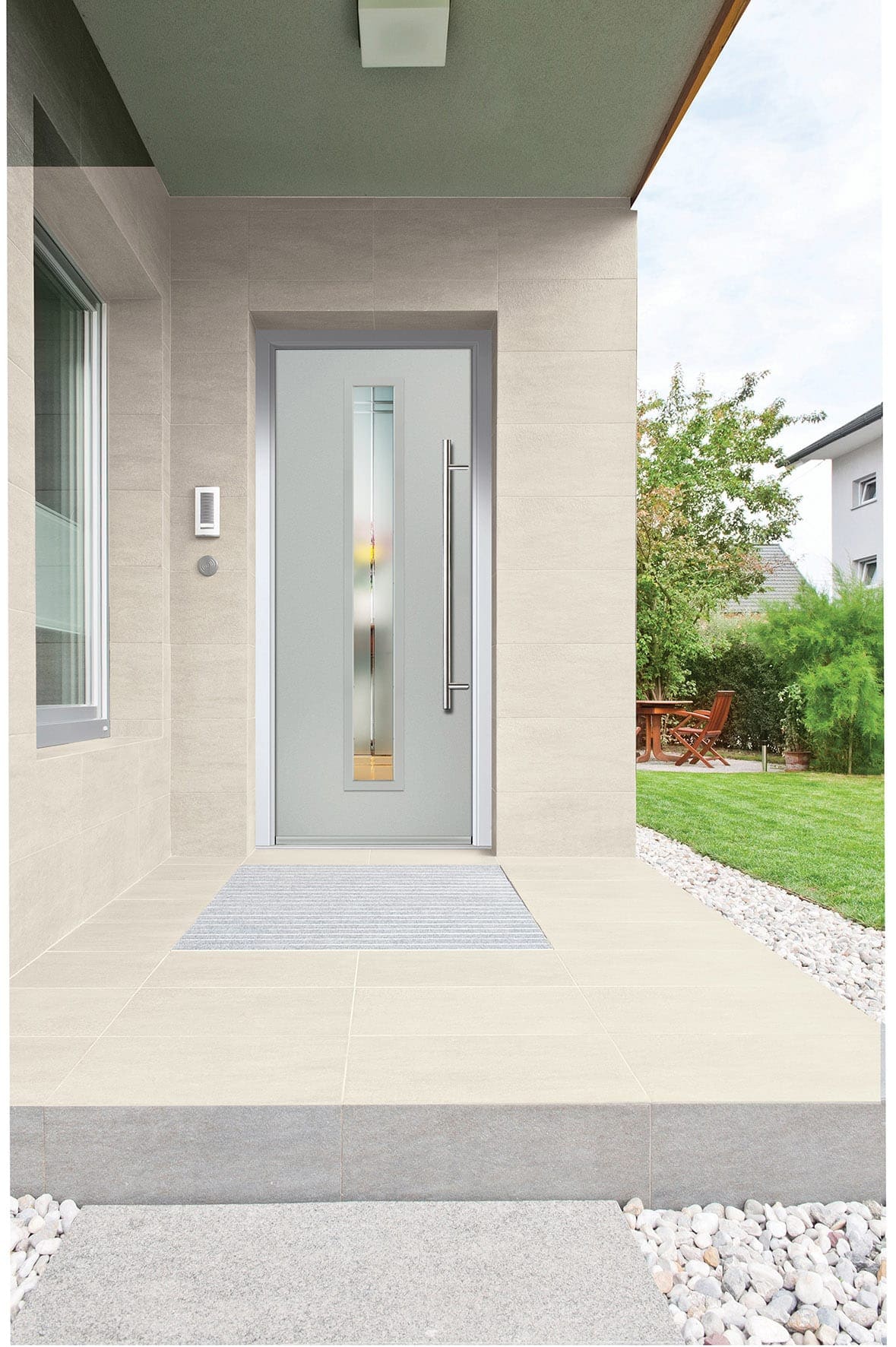 Grey aluminium front door with a glazed sidelight on a modern home