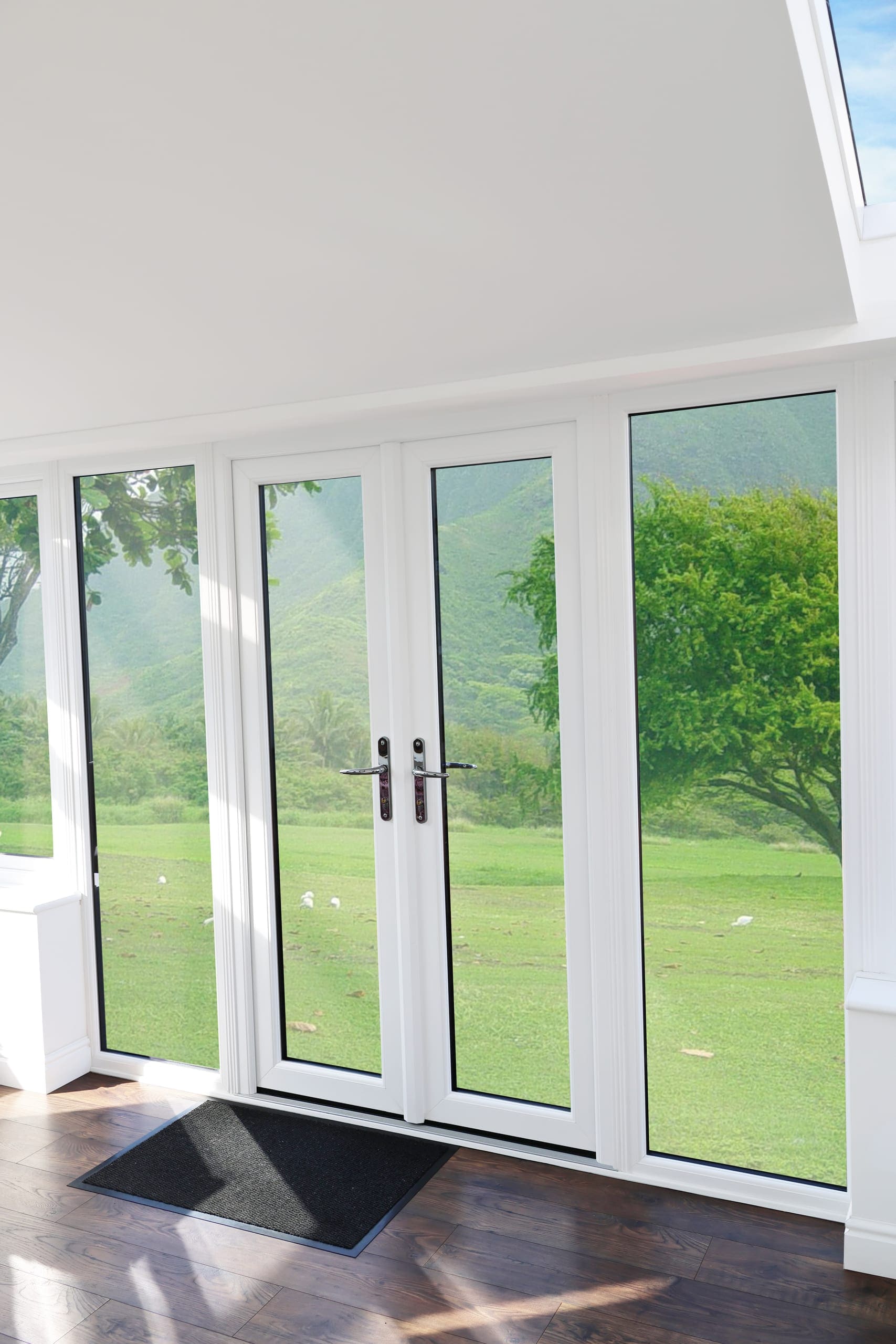 White French doors framing a countryside view