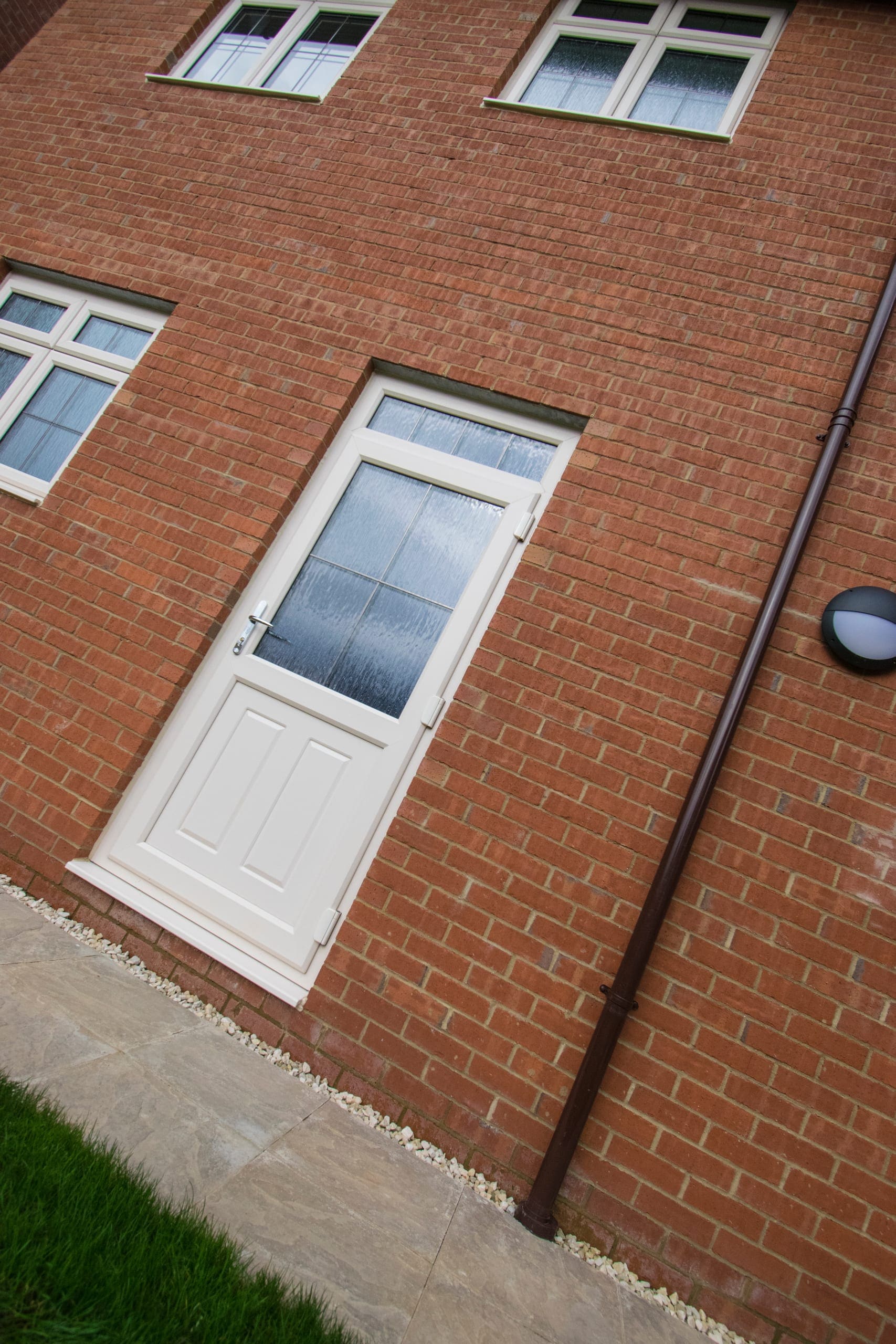 White uPVC door with an obscure-glazed panel