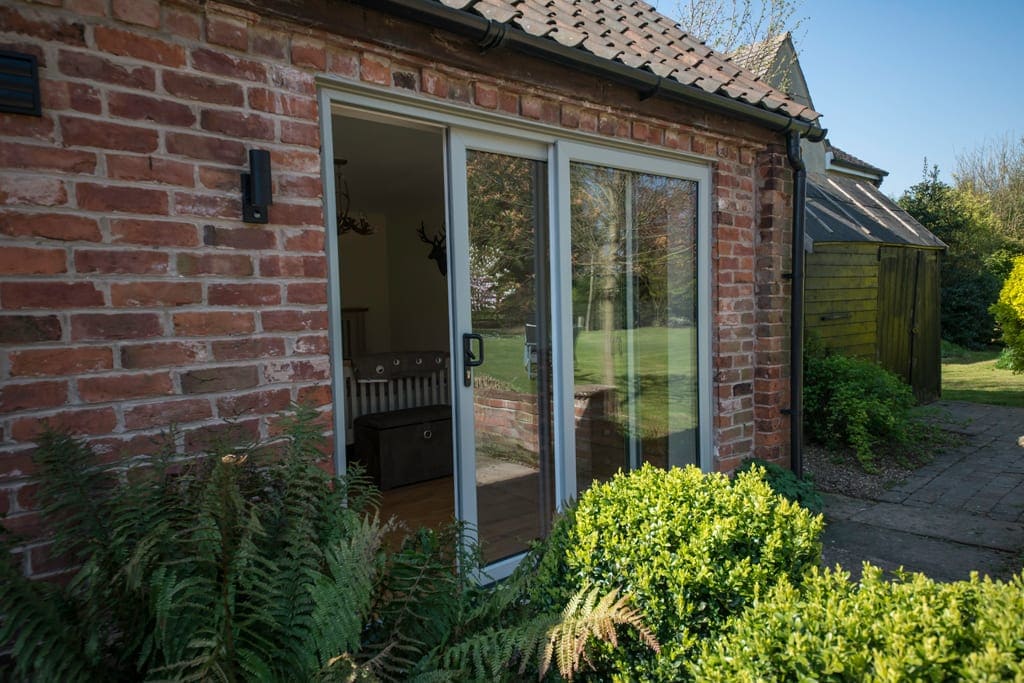Sliding patio doors on a brick barn conversion