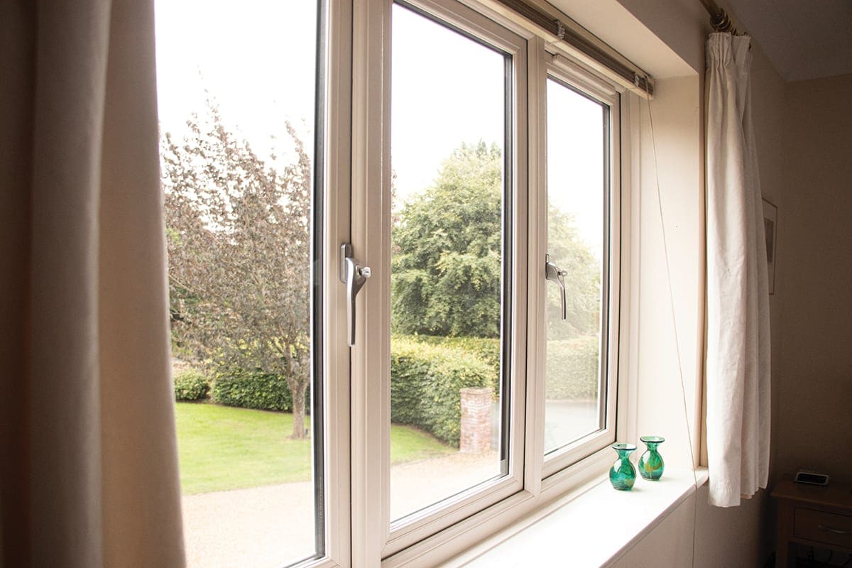 White uPVC window looking out over the garden