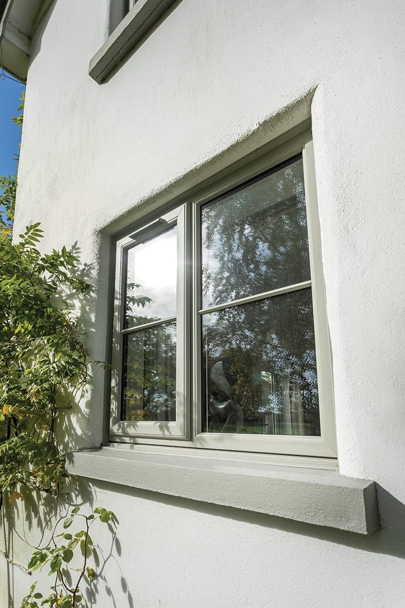 White uPVC casement window on a rendered house